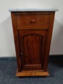 A Victorian mahogany marble topped pot cupboard