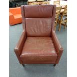 A mid 20th century Scandinavian red leather high backed armchair