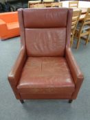 A mid 20th century Scandinavian red leather high backed armchair