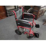 A folding light weight wheel chair with footrests