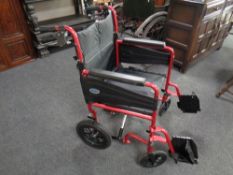 A folding light weight wheel chair with footrests