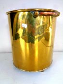 A 19th century brass coal bucket with copper handles