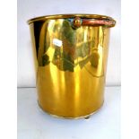 A 19th century brass coal bucket with copper handles