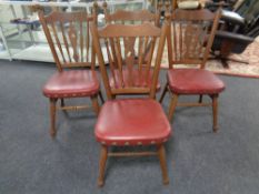 A set of four stained beech farmhouse style kitchen chairs