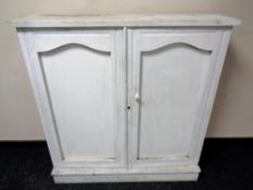 A 19th century painted pine double door cupboard (lacking shelves)