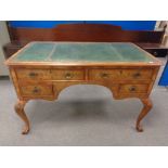 A burr walnut leather topped writing desk fitted four drawers