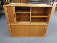 A pair of mid 20th century teak shutter door wall cabinets