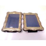 A pair of silver photo frames.