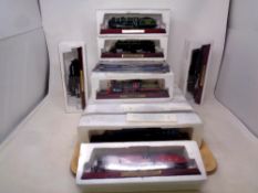 A tray of thirteen Atlas Editions models of locomotives with accompanying magazines