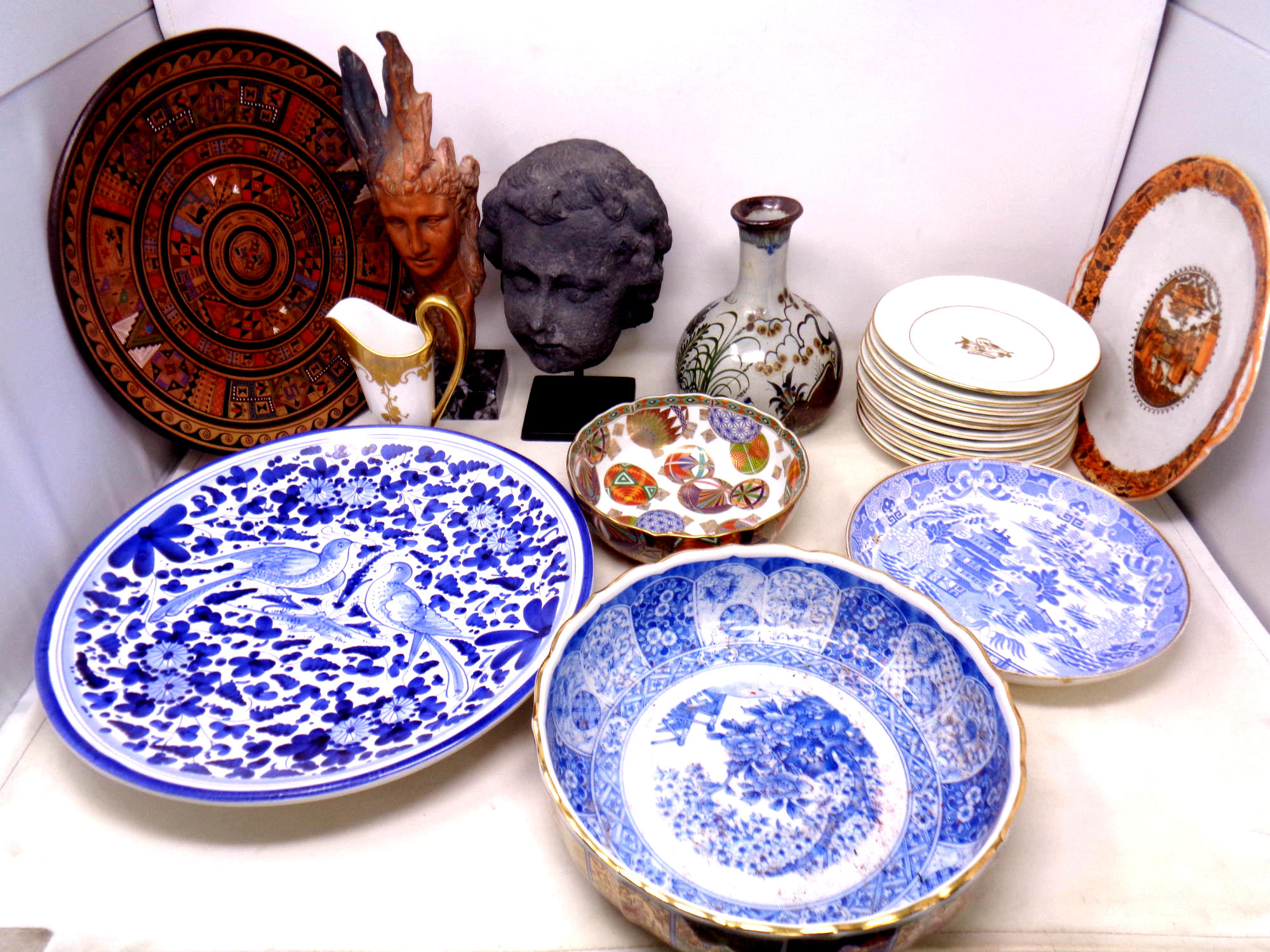 A tray of antique and later ceramics to include white and gilt tea ware, oriental style bowls,