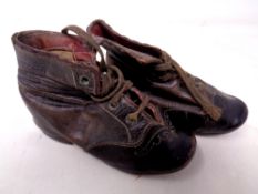 A pair of 19th century hand stitched leather children's shoes