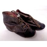 A pair of 19th century hand stitched leather children's shoes