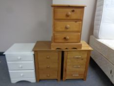 Four contemporary three drawer bedside chests