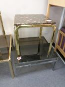 A brass framed and marble topped occasional table and a chrome coffee table with smoked glass top