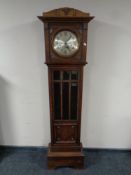 An oak cased regulator clock with silvered dial