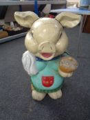 A 20th century painted wooden figure of a pig,