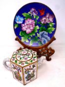 A cloisonne plate on carved wooden stand,