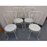 A set of four metal garden patio chairs