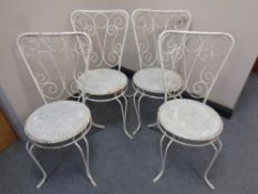 A set of four metal garden patio chairs