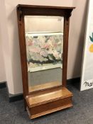 An Edwardian oak hall mirror,