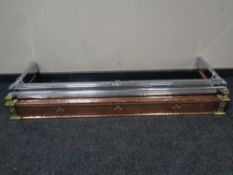 An Arts and Crafts hammered copper and brass fire curb plus a chrome fire curb