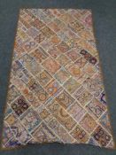 A patchwork wall hanging 170 cm x 100 cm