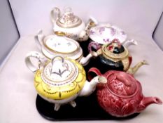 A tray of six 19th century and later china and ceramic teapots