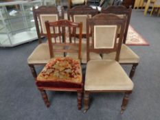 A set of four carved Edwardian dining chairs and one further chair