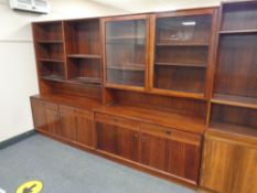 A mid 20th century Danish two piece display unit fitted cupboards and drawers