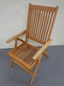 A teak garden steamer chair