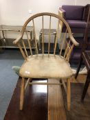 A mid century Danish pine and beech stick back armchair