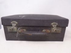 A vintage doctor's case containing medical instruments