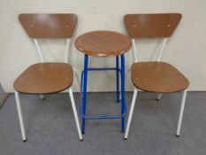 A pair of tubular metal and melamine dining chairs,