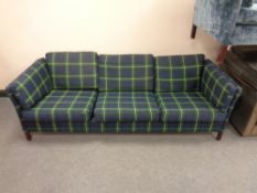A 20th century Scandinavian three seater settee in checked fabric