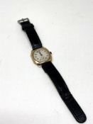 A gent's vintage 9ct gold cushion shaped wristwatch