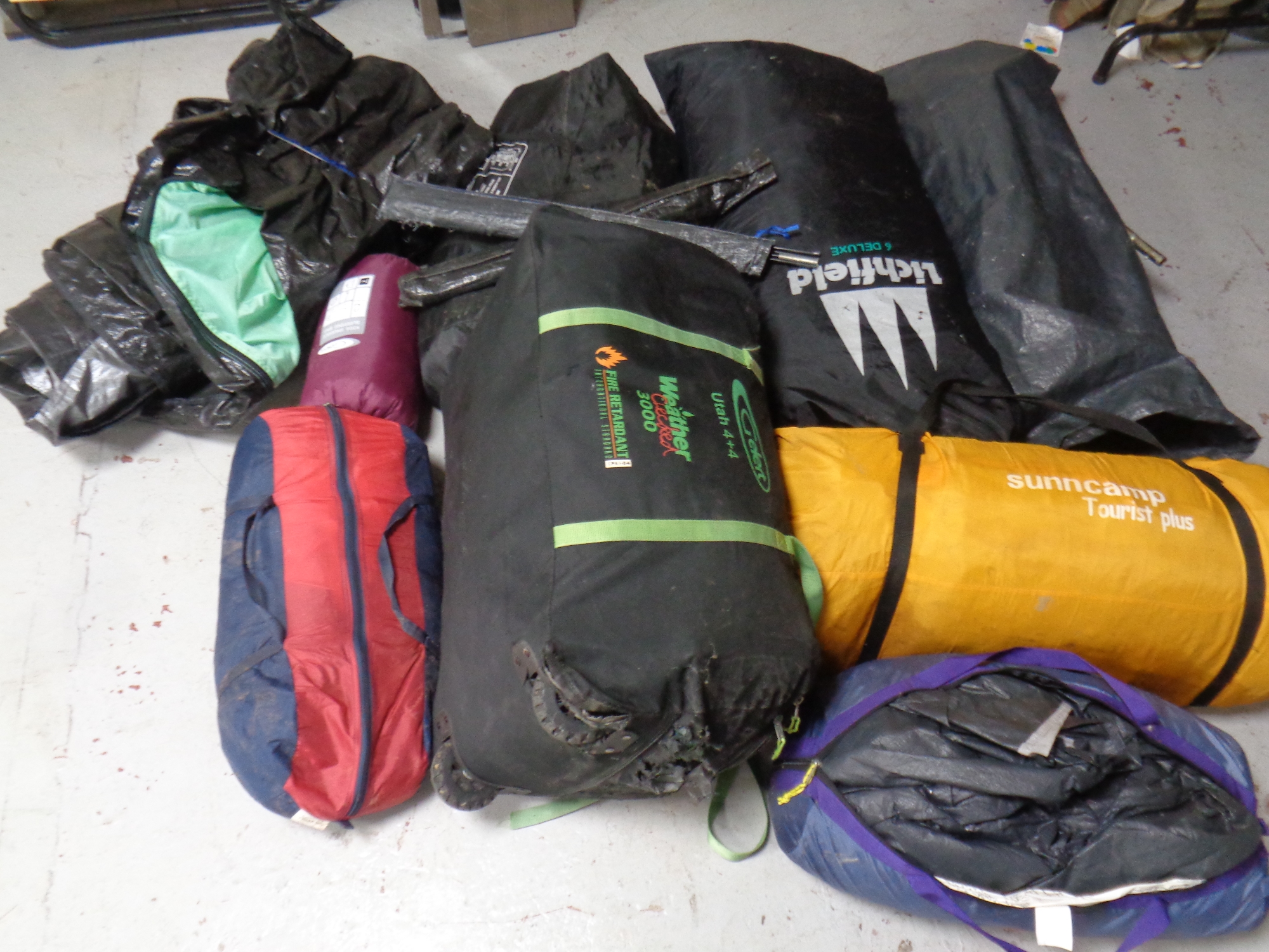 A large quantity of camping equipment to include tents, ground sheets,