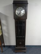 A oak cased regulator style clock with circular silvered dial, pendulum,