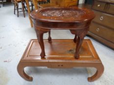 A Chinese style low coffee table together with a further Eastern occasional table with brass inlay