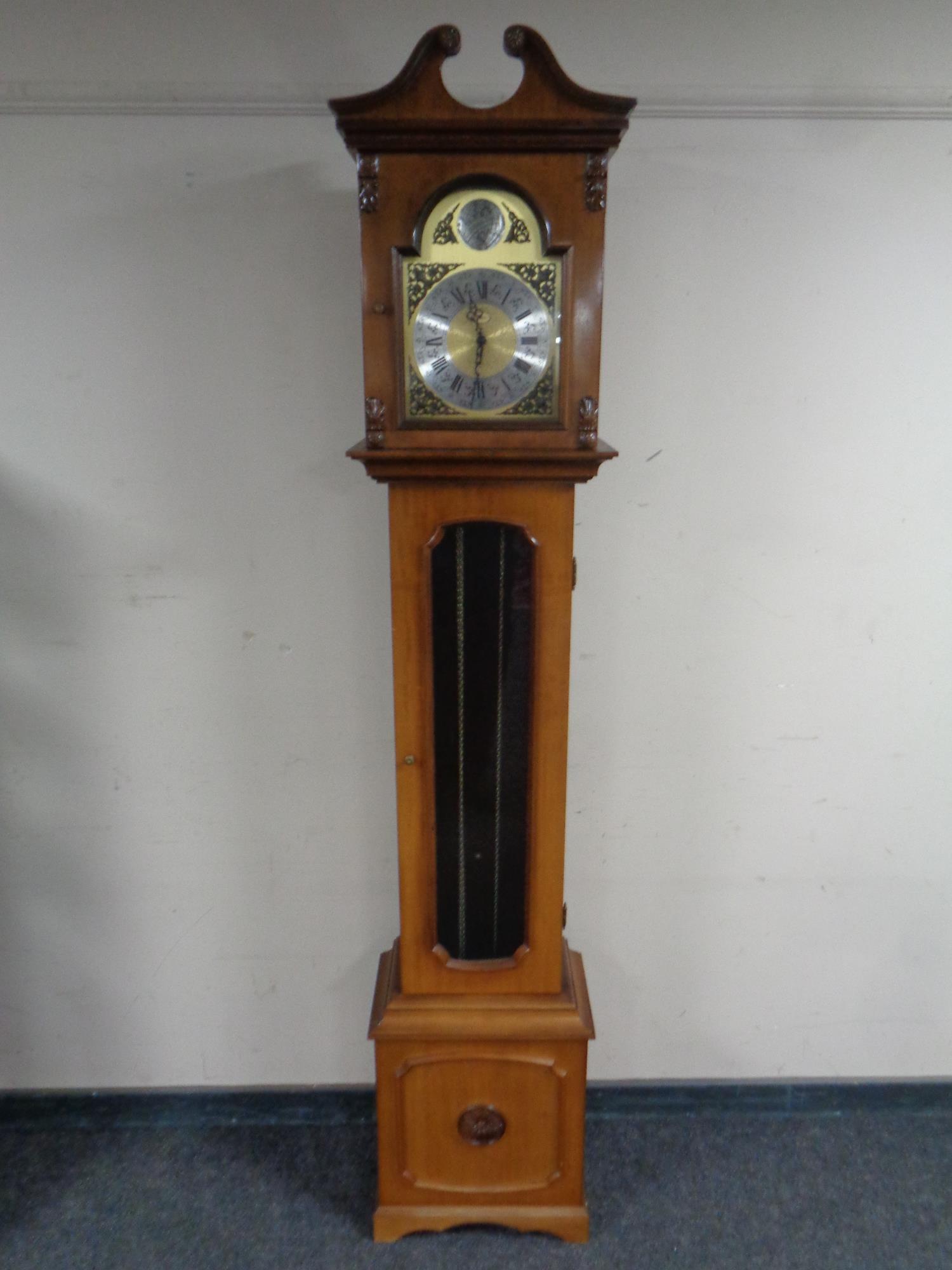 A Tempus Fugit by Artime longcase clock. Weights, no pendulum.