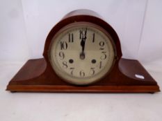 A mahogany cased German 8 day mantel clock with silvered dial