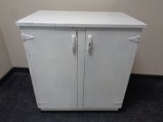 A metal double door cabinet fitted internal shelves and drawers (painted)