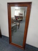 A 19th century continental mahogany framed bevel edged hall mirror.