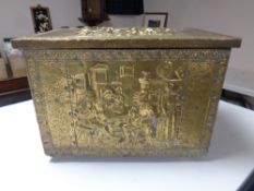 An early 20th century brass embossed coal box.