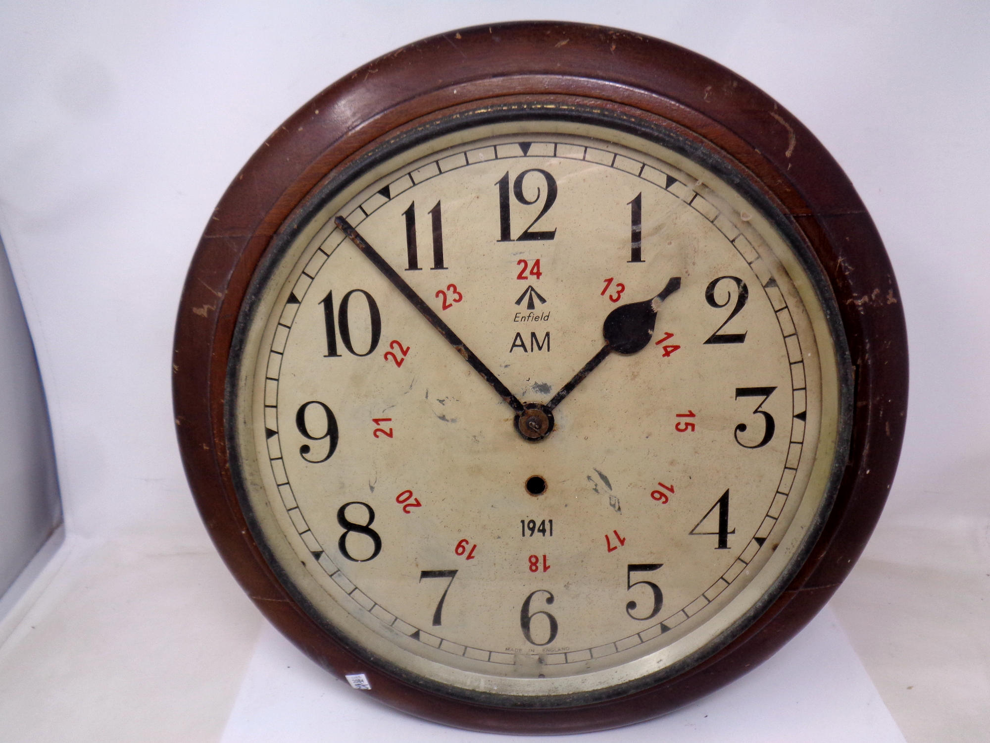 A twentieth century circular wall clock with Enfield dial
