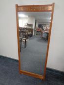 A 20th century teak and copper framed hall mirror,