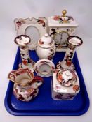 A tray containing seven pieces of Masons Mandalay china to include mantel clock, candlesticks,