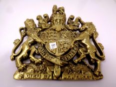 An antique brass plaque : Royal coat of arms