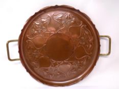 A shaped copper Art Nouveau tray with brass handles.