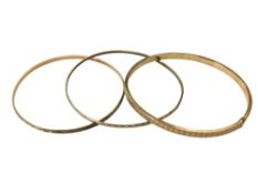 Three 9ct gold bangles, 9.9g.