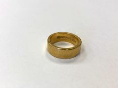 A 22ct gold band ring, size I1/2 CONDITION REPORT: 8.